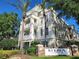 A Siena Celebration condo building featuring multiple stories, balconies and decorative architectural details at 1021 Siena Park E Blvd # 301, Celebration, FL 34747