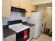 Well-equipped kitchen with modern appliances, ample counter space, and a convenient laundry area at 1021 Siena Park E Blvd # 301, Celebration, FL 34747