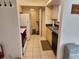 Functional kitchen with an efficient layout, modern appliances, and a convenient laundry room at 1021 Siena Park E Blvd # 301, Celebration, FL 34747