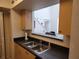This kitchen features a breakfast bar that opens up into the living area, perfect for entertaining at 1021 Siena Park E Blvd # 301, Celebration, FL 34747