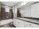 The bathroom boasts a granite countertop, stylish tile flooring, and a shower-tub combo at 10743 Belfry Cir, Orlando, FL 32832