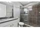 Bathroom featuring a granite countertop, tile flooring, and glass shower at 10743 Belfry Cir, Orlando, FL 32832