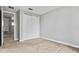 Bedroom with neutral carpet, light gray walls, and closet with double doors at 10743 Belfry Cir, Orlando, FL 32832