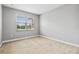 Bedroom with neutral carpet, light gray walls, and a double hung window at 10743 Belfry Cir, Orlando, FL 32832