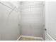 Walk-in closet featuring metal shelving and carpeted floor at 10743 Belfry Cir, Orlando, FL 32832