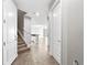 The foyer features tile flooring, and staircase and provides a welcoming entrance to the home at 10743 Belfry Cir, Orlando, FL 32832