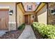 The front entrance features a landscaped walkway, decorative lighting, and an inviting door at 10743 Belfry Cir, Orlando, FL 32832
