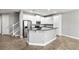 Kitchen boasting granite countertops, a breakfast bar, and stainless steel appliances at 10743 Belfry Cir, Orlando, FL 32832