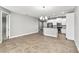 Bright open-concept living space with tile floors and neutral wall paint at 10743 Belfry Cir, Orlando, FL 32832