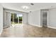 Light filled living space with sliding glass door and tile flooring at 10743 Belfry Cir, Orlando, FL 32832