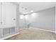 Upstairs room with neutral paint, carpet, and closet access at 10743 Belfry Cir, Orlando, FL 32832