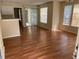 Living room with laminate flooring and sliding glass doors that let in plenty of natural light at 1089 S Hiawassee Rd # 314, Orlando, FL 32835