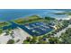 A waterfront marina showcases a picturesque harbor with neatly docked boats under a bright sky and lush green surroundings at 1110 Virginia Ave, St Cloud, FL 34769