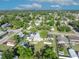 Aerial view showcases the neighborhood's lush greenery and residential layout at 1110 Virginia Ave, St Cloud, FL 34769