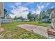 Expansive backyard featuring lush grass, a storage shed, and partial fencing at 1110 Virginia Ave, St Cloud, FL 34769