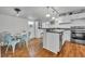 Bright kitchen features white cabinets, a peninsula, and stainless steel appliances at 1110 Virginia Ave, St Cloud, FL 34769