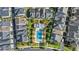 Aerial view of modern townhomes surrounding a community pool and landscaped common area at 1123 Mahonia Ct, Lake Mary, FL 32746