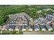 Birds eye view of the neighborhood featuring modern gray and white townhouses and landscaped surroundings at 1123 Mahonia Ct, Lake Mary, FL 32746
