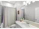 Well-lit bathroom with a shower, tub, and neutral colored accents at 1123 Mahonia Ct, Lake Mary, FL 32746