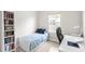 Bright bedroom featuring a bookcase, natural light, desk and modern décor at 1123 Mahonia Ct, Lake Mary, FL 32746