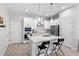 Modern kitchen featuring an island with counter seating and stainless-steel appliances at 1123 Mahonia Ct, Lake Mary, FL 32746