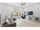 Bright living room with tile floors, large window, and stylish furnishings at 1123 Mahonia Ct, Lake Mary, FL 32746
