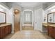 Bathroom featuring a large tile floor, double vanity, soaking tub, and glass shower at 11345 Preserve View Dr, Windermere, FL 34786