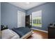 Cozy bedroom with hardwood floors, natural light and a closet at 11345 Preserve View Dr, Windermere, FL 34786