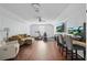 Bright bonus room with hardwood floors, comfortable seating, exercise equipment, and large-screen monitor at 11345 Preserve View Dr, Windermere, FL 34786