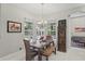 Bright dining area with lots of light and windows, featuring unique table and decorative accents at 11345 Preserve View Dr, Windermere, FL 34786