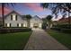 Charming two-story home featuring a paver driveway and professional landscaping at 11345 Preserve View Dr, Windermere, FL 34786