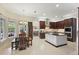 Bright kitchen with stainless steel appliances, dark wood cabinets, and breakfast nook at 11345 Preserve View Dr, Windermere, FL 34786