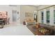 Bright living room featuring white tile floors, comfortable seating, and elegant décor at 11345 Preserve View Dr, Windermere, FL 34786