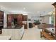 Open concept living space with kitchen island flowing to dining and living rooms at 11345 Preserve View Dr, Windermere, FL 34786