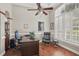 Spacious home office with hardwood floors, tray ceilings, and large windows with plantation shutters at 11345 Preserve View Dr, Windermere, FL 34786