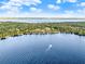 Scenic aerial shot of a lake with clear blue waters, perfect for boating and recreation at 12228 Kirby Smith Rd, Orlando, FL 32832