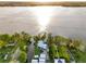 Stunning waterfront home with lush landscaping and private dock, offering serene lake views at 12228 Kirby Smith Rd, Orlando, FL 32832