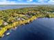 Picturesque aerial view of lakefront properties with private docks and lush green surroundings at 12228 Kirby Smith Rd, Orlando, FL 32832