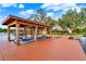 Modern boat dock with a boat lift, situated on the water with a view of the home at 12228 Kirby Smith Rd, Orlando, FL 32832