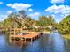 Spacious dock with covered seating, perfect for relaxing and enjoying waterfront views at 12228 Kirby Smith Rd, Orlando, FL 32832