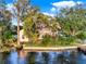 Charming waterfront home with a dock and lush landscaping, offering a peaceful retreat at 12228 Kirby Smith Rd, Orlando, FL 32832