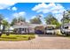 Lovely home featuring a long driveway, a carport, and well-manicured yard at 12228 Kirby Smith Rd, Orlando, FL 32832