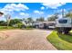 Charming single-story home featuring a brick driveway, carport and RV parking on a well-manicured lot at 12228 Kirby Smith Rd, Orlando, FL 32832