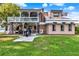 Charming two-story home with a balcony, well-maintained lawn, and a concrete path leading to the entrance at 12228 Kirby Smith Rd, Orlando, FL 32832