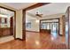 Spacious living room featuring hardwood floors, wood accents, and lots of natural light at 12228 Kirby Smith Rd, Orlando, FL 32832