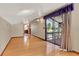 Bright living room with hardwood floors, large sliding glass doors, and access to bathroom at 12228 Kirby Smith Rd, Orlando, FL 32832