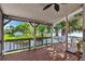 Enclosed outdoor porch with weathered wood and screened in panels with view of water at 12228 Kirby Smith Rd, Orlando, FL 32832