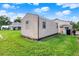 A large, metal sided shed sits on a grassy area, offering plenty of space for storage and hobbies at 12228 Kirby Smith Rd, Orlando, FL 32832