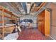 Inside the shed, find ample storage with wooden shelves and a rustic wooden cabinet, ready for organizing your items at 12228 Kirby Smith Rd, Orlando, FL 32832