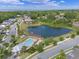 Beautiful aerial view of community pool, lake, and well-manicured landscaping at 1324 Painted Bunting Ave, Oakland, FL 34787